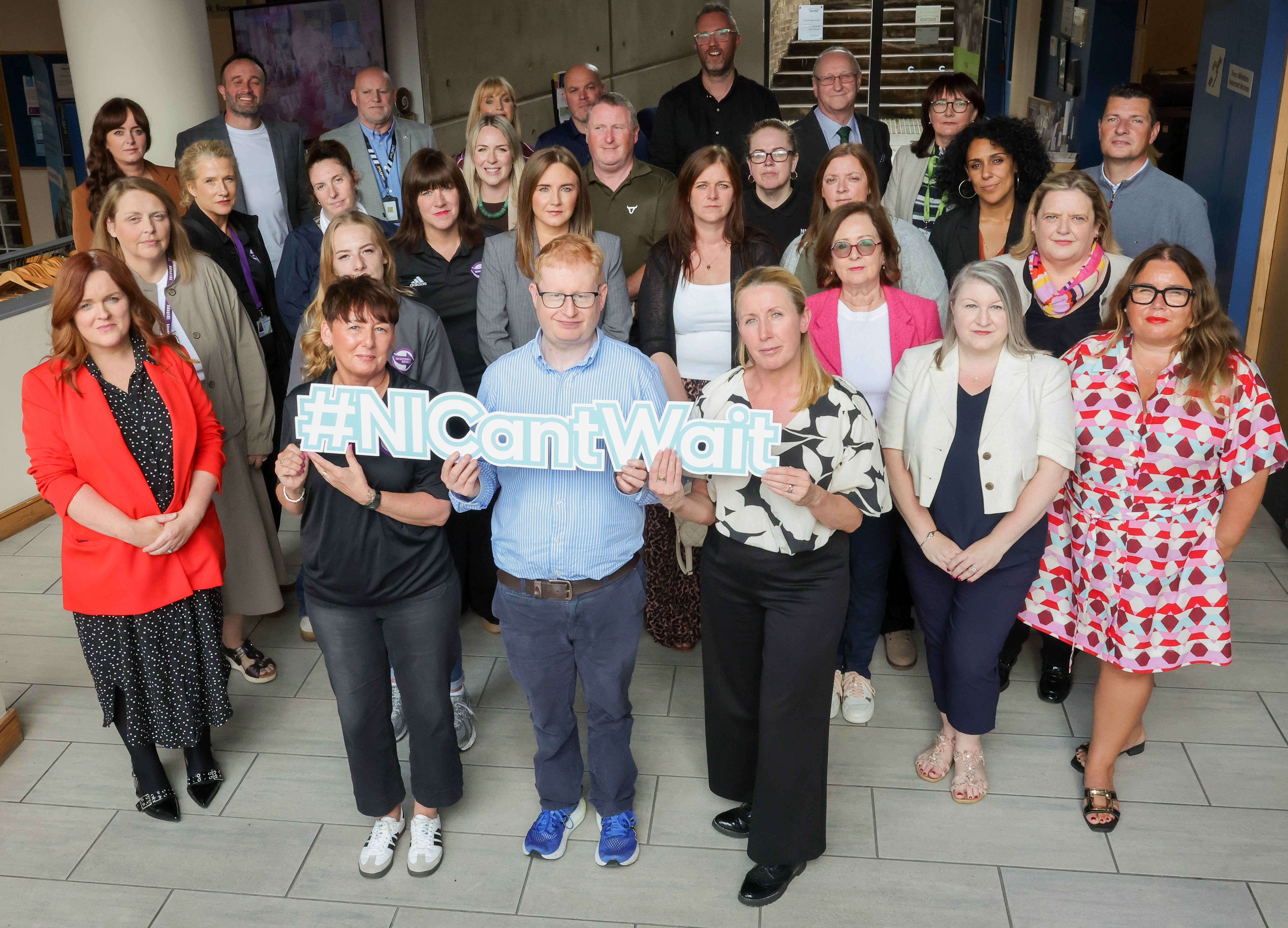 Photo of the Economic Inactivity Coalition launching the #NICantWait campaign