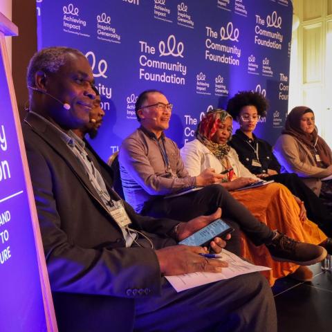 Photo of a panel of speakers pictured at the conference