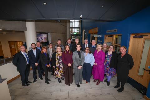 NICVA CEO Celine McStravick, service providers and members of the NI Affairs Committee pictured in NICVA